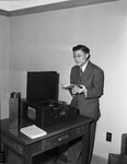 Mou-Che Lieu, Chinese aeronautical engineer, in record room at public library