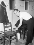 George A. Angelico, storekeeper first class, preparing for a shower at SMC