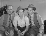 Lew Jenkins, boxer, posing with managers Gred Browning and Hymie Caplin