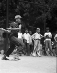 Fort Worth Recreation Department junior baseball league catcher John Mosley at the bat