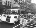 Crowd and ambulance in front of Worth Theater