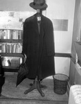 Hat, coat and umbrella on hatstand