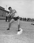 George Kadera, Texas Aggie weight man, displaying his shot put form