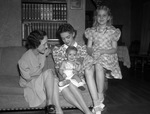 Left to right, Mrs. B. W. Holloman of Leesville, Louisiana; Mrs. Holloman's daughter, Mrs. Don Robinson of Poteau, Oklahoma, with her son, David Brooks Robinson, in her lap, and Janis Terrell of Leesville