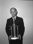 R. D. Waggener of Fort Worth, shown holding Elmer Crowe memorial trophy