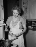 Mrs. Charlie Rupard frying pastry shells