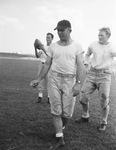 Texas Christian University football coach Dutch Meyer with players