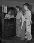 Oaklawn Elementary School pupils buying defense stamps