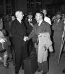 President E. M. Waits of Texas Christian University welcoming football coach Dutch Meyer back from North Carolina