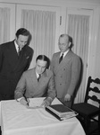 H. H. Morse, president of Fort Worth Real Estate Association, shown signing a check for the Association's contribution to land purchase fund for Big Bend National Park