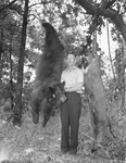 J. J. Gray, Fort Worth grocer, with 400 pound bear and 300 pound deer