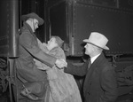 United States National Guard leaving for training: Corporal George P. Gleeson, Junior with parents