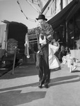 Christmas shopper, Joe Howard carrying load of toys