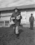 Military training at Camp Bowie, Brownwood, Texas, World War II; 2nd Lieutenant Newton W. Lantron of Company L returning from canteen with tobacco supplies for his tent