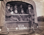 Camp Bowie, Brownwood, Texas, World War II; Pvts. L.P. Holcomb, Raymond Griffin, Jack Harmon, and Corporation Robert Williams from back of transport truck as they arrive at Camp Bowie