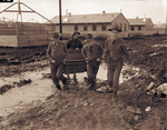 Camp Bowie, Brownwood, Texas, World War II; Pvts. Alton Sorelle, Mason Love (on cart), Garland Holt, and Corporation Claude Addington at Company L, Camp Bowie