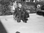 T. C. Rhodes and his two cocker spaniels