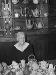 Mrs. Robert Jones with her collection of tea pots