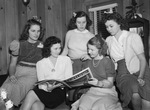 Young women looking at an issue of "Fortune" magazine