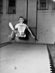 Roy Clark bouncing on trampoline
