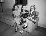 Mrs. Jack C. Riley, Mrs. William B. Hoover and Karen Hoover on couch