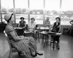Robbie Sparks, Mrs. Harlon J. Koehler, Claudia Maxwell, and Mrs. D. H. Goodman painting model Mrs. J. L. Slayton