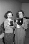 Mrs. Herman Rosenzweig holding Texglass, Inc pitcher