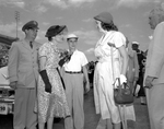 Mrs. Douglas MacArthur talks with an old town friend, Mrs. Herschel Stine Jr.