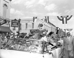 General Douglas MacArthur and family greet spectators of the parade