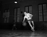 Winston Kimsey of Arlington Heights dribbling basketball