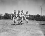 Quarterback Vernon Glass, Halfbacks Dub Graves and Rex Proctor, and Fullback Jim Jeffrey