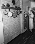 Mrs. Fred Thompson with electric oven