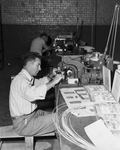 Sam McDaniel of Saginaw shown operating electric wire stamper