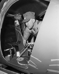 Benjamin F. Boone shown inside plastic nose of helicopter