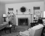 Mrs. Roy V. Brasher in living room