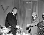 Amon Carter shown congratulating R. B. (Bob) Anderson of Vernon at Oil and Other Industries dinner