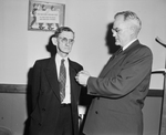 A. W. Sullivan is presented pin by G. N. Westerfeld