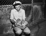 Acy B. Smith shown with lion cubs at Forest Park Zoo