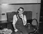Allen Collet, machinist apprentice eating sandwich