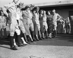 Shot of unidentified legs and feet of Aggies and TSCW girls by Wilburn Davis