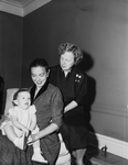 Mrs. Harry N. Harris, shown holding her daughter, Eleanor Elatia. Mrs. Robert Sansom, Mrs. Harris's mother at right