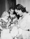 Mrs. W. G. Bedworth Jr. with daughters Donna Lynn, left, and barbara Ann. Baby is William Arthur Bedworth