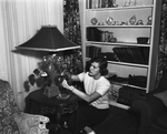 Yvonne Allen with lamp she designed by Ray McGehee