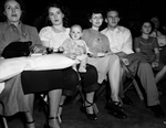 Golden Gloves spectators Mrs. Earl Rice and baby Linda Jo