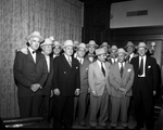Group of unidentified airport executives in Mr. Carter's office. Maury H. Huffman, executive director the Greater Fort Worth, Texas International Airport is in picture
