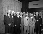 Group of unidentified airport executives in Mr. Carter's office. Maury H. Huffman, executive director the Greater Fort Worth, Texas International Airport is in picture