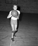 Bob McGill holds basketball posed