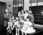 Amon Carter with children from Babyland of the Lena Pope Home