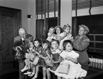 Amon Carter with children from Babyland of the Lena Pope Home
