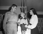 Lieutenant and Mrs. Carpenter and son inside their home in Fort Worth, Texas